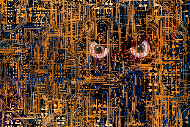 abgebildet sind komplexe digitale Netzwege in orange sowie ein Augenpaar das aus dem dunklen Hintergrund hervorblickt (Quelle: ©John Lund via Getty Images) abgebildet sind komplexe digitale Netzwege in orange sowie ein Augenpaar das aus dem dunklen Hintergrund hervorblickt