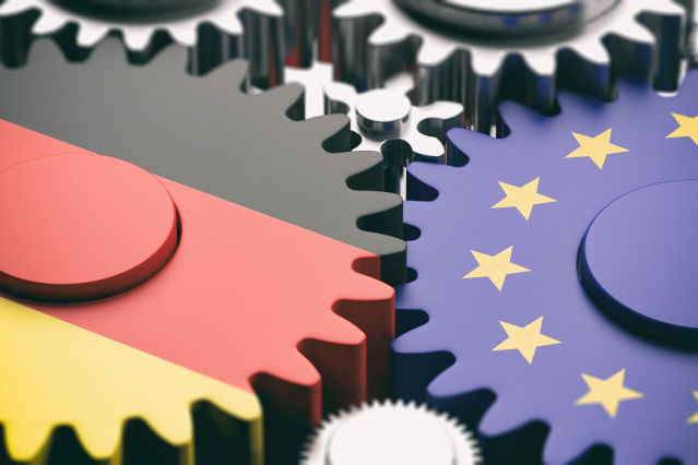 refer to: Contact to the Single Contact Point (Source: ©Rawf8 - stock.adobe.com) printed gear wheels, one with the German flag and one with the European flag (refer to: Contact to the Single Contact Point)